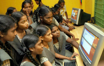 Students trying their hand at the computer centre which was inaugurated in Medavakkam High School on Thursday.